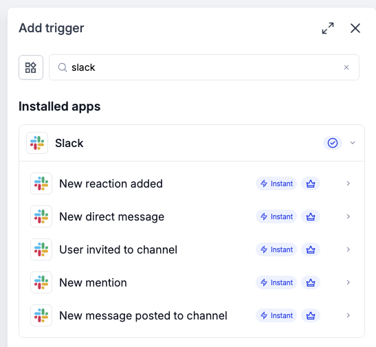 Slack workflow trigger picker with five Instant triggers and Premium markers.